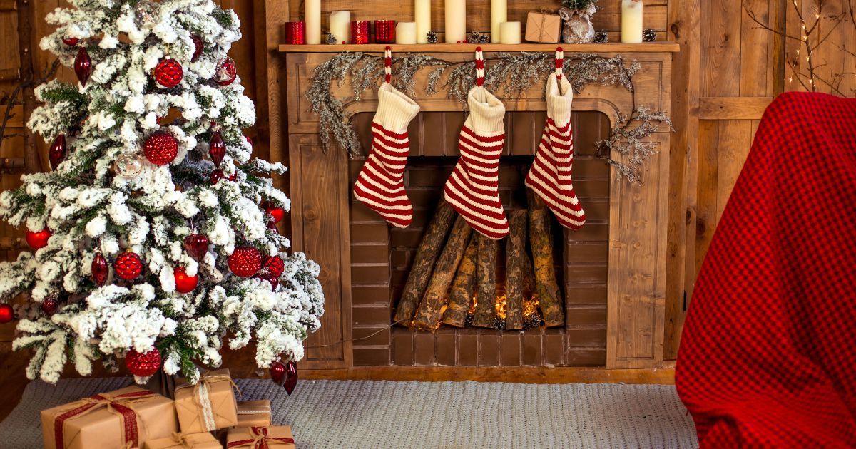 Fireplace, Christmas gifts and Christmas tree with Christmas socks